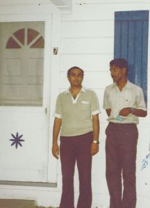 With my friend Kumar (left) in front of a motel we stayed at 